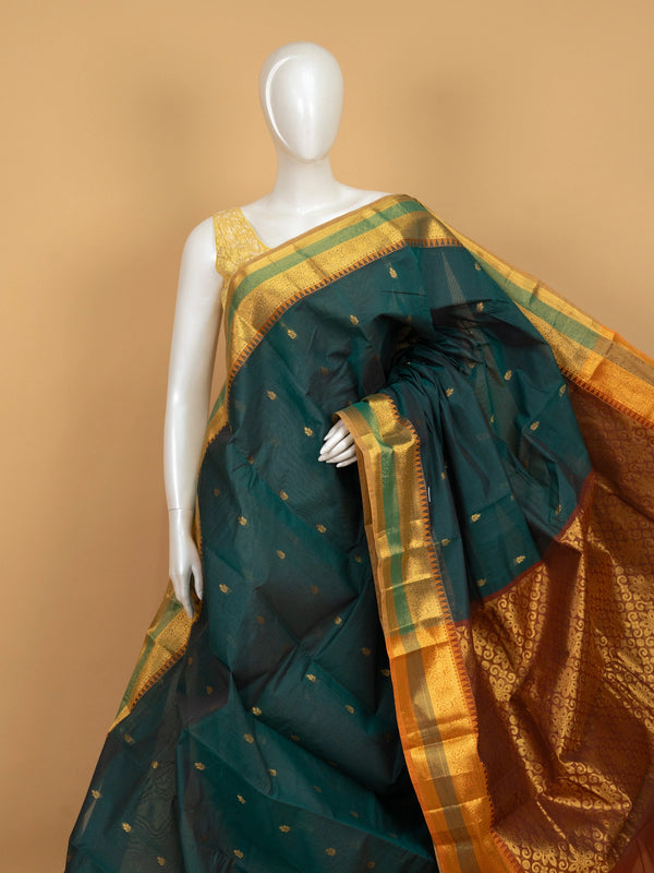 Teal green Chettinad cotton saree with gold zari buttas, temple border and contrast maroon zari pallu