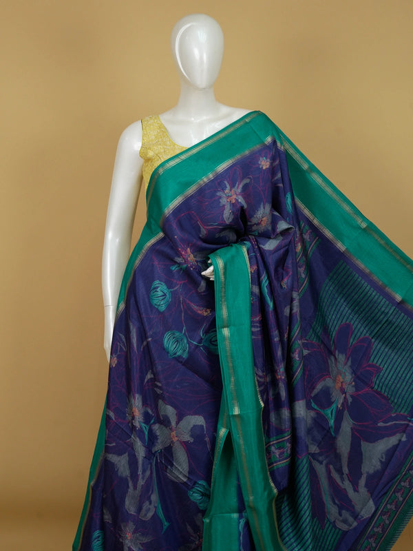Navy-blue Dola silk saree with floral print and contrast teal-green zari border