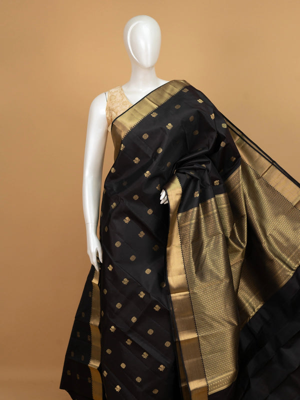 Black pure Kanchipuram silk saree with gold zari buttas and broad zari border