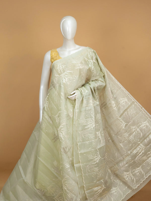 Sage green organza designer saree with white leaf embroidery and contrast yellow blouse