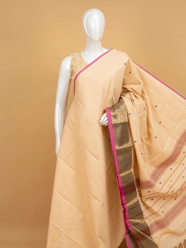 Cream Chettinad cotton saree with pink gold zari border and paisley buttis