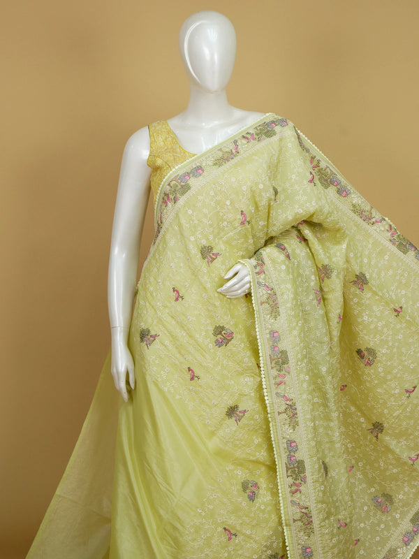 Lime green designer saree with white floral jaal, pink bird, tree and elephant embroidery and matching blouse