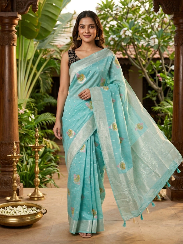 Aqua blue linen cotton saree with silver zari border, colourful peacock motifs and contrast black blouse