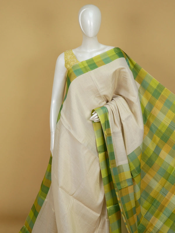 Cream linen cotton saree with green and yellow checked border and pallu