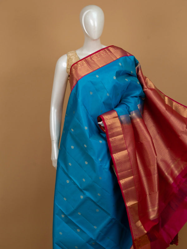 Peacock blue pure Kanchipuram silk saree with contrast pink and gold zari border and pallu