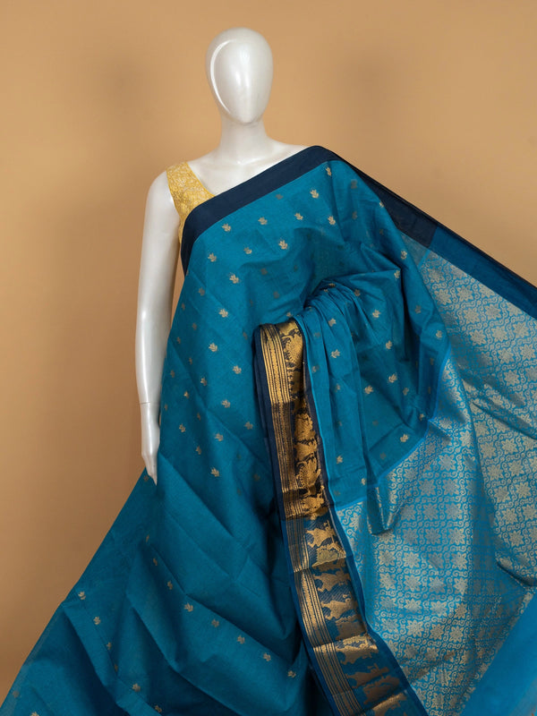 Peacock blue Chettinad cotton saree with gold zari lotus buttas and contrast navy figurative zari border