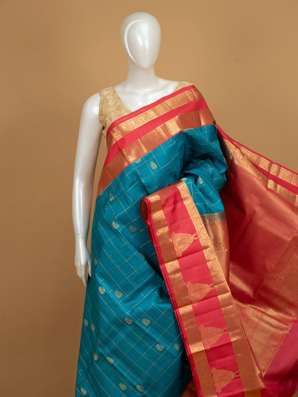 Peacock blue pure Kanchipuram silk saree with gold zari checks, peacock motifs and contrast pink zari border