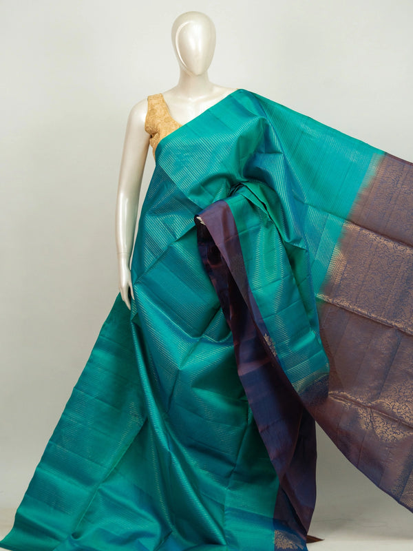 Teal green Kanchipuram Pure Mix saree with purple contrast border and gold zari brocade pallu