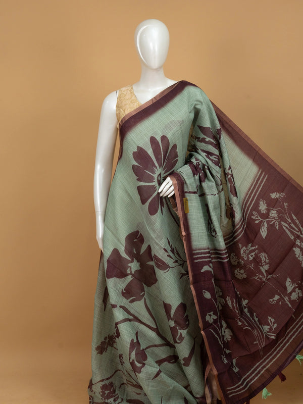Sage green linen cotton saree with maroon floral prints and contrast maroon border