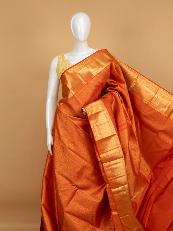 Orange pure Kanchipuram silk saree with allover gold zari brocade and wide gold zari border