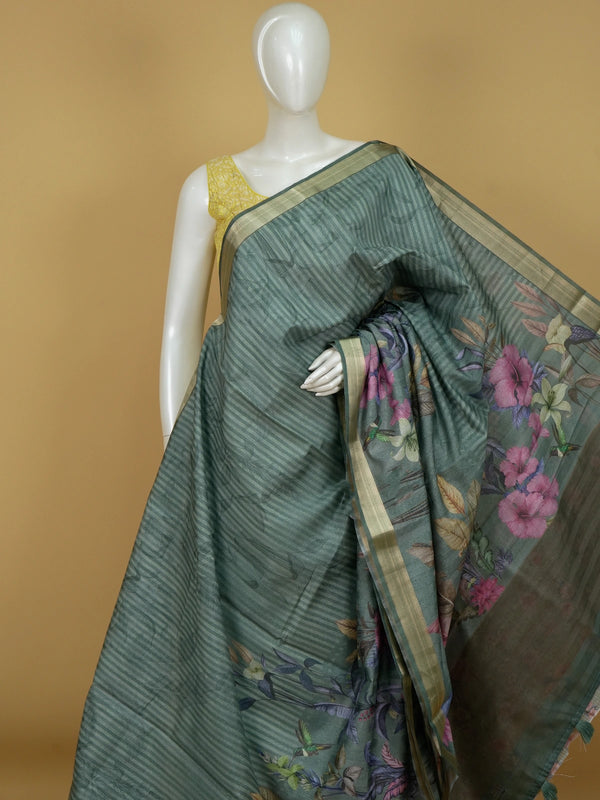 Sage green semi tussar saree with tropical floral print pallu and gold zari border