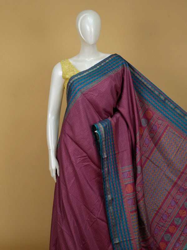 Magenta pink Dola silk saree with teal-blue contrast checked border and floral motif pallu