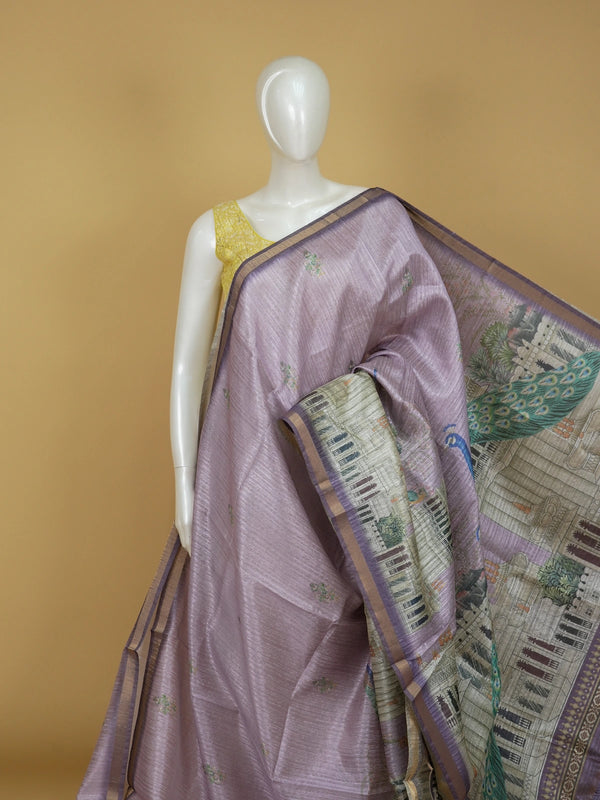 Lavender semi tussar saree with purple gold zari border and peacock and palace printed pallu