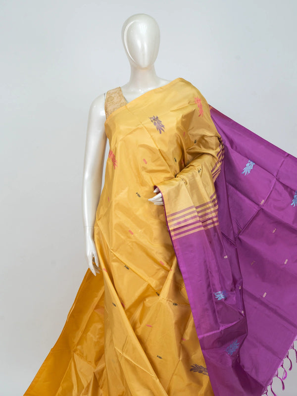 Mustard yellow banana silk saree with contrast magenta pallu, gold zari striped border and woven floral buttas