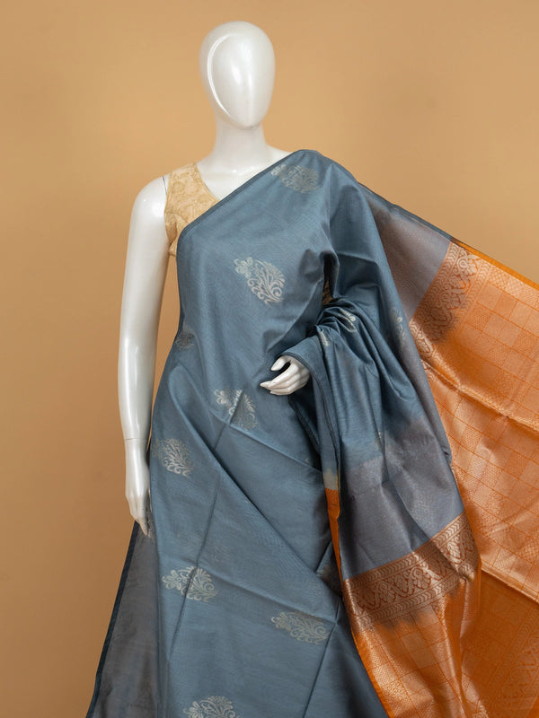 Grey silk cotton saree with mustard-orange contrast zari border and gold buttas