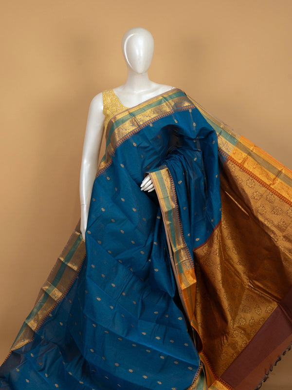 Peacock blue Chettinad cotton saree with gold zari buttas, temple zari border and contrast mustard-gold pallu