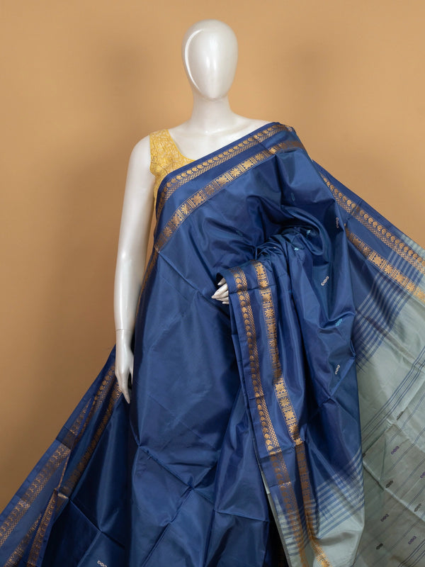 Navy blue banana silk saree with gold zari border and contrast grey pallu