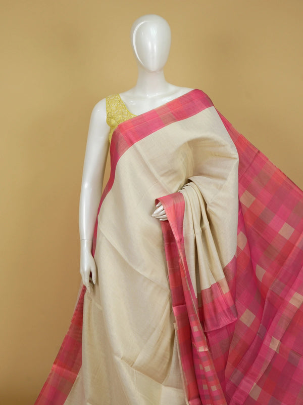 Cream linen cotton saree with pink checked contrast border and pallu