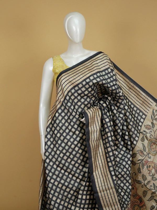 Beige and black checked semi tussar saree with black border and Kalamkari-style bird and floral pallu