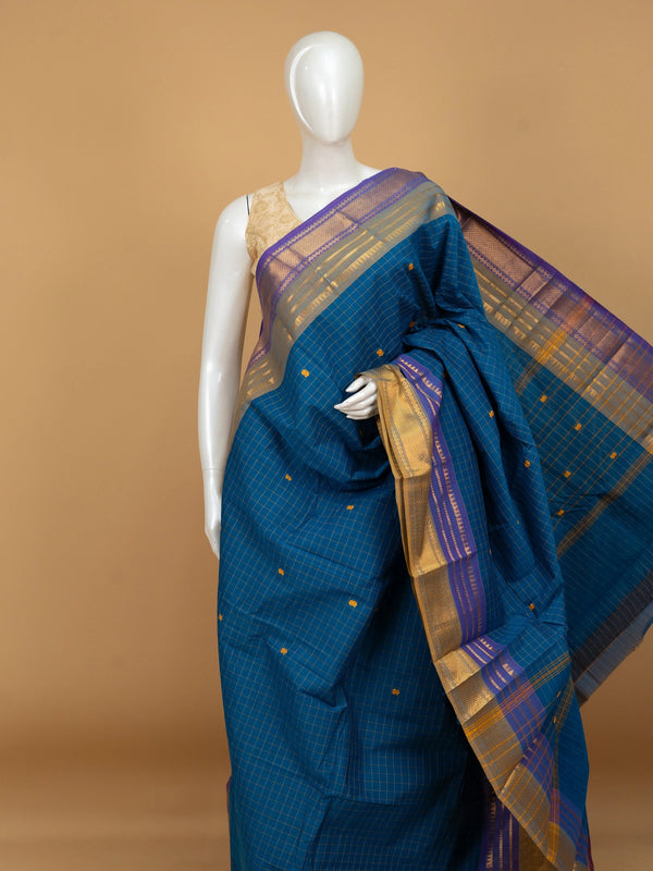 Peacock blue Chettinad cotton saree with gold checks, mustard butta motifs and contrast purple gold zari border