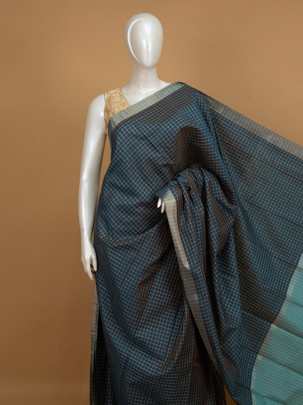 Teal linen cotton saree with white and gold checks, contrast zari border and striped turquoise pallu