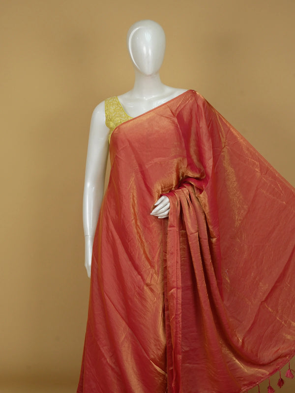 Coral orange and gold tissue designer saree with gold zari border and contrast yellow floral printed blouse