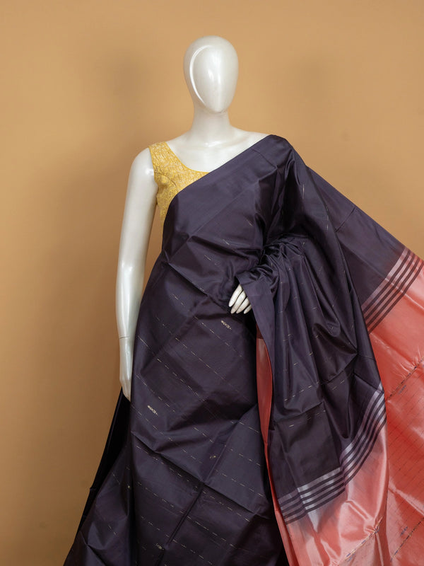 Aubergine banana silk saree with coral zari-striped pallu and contrast blouse
