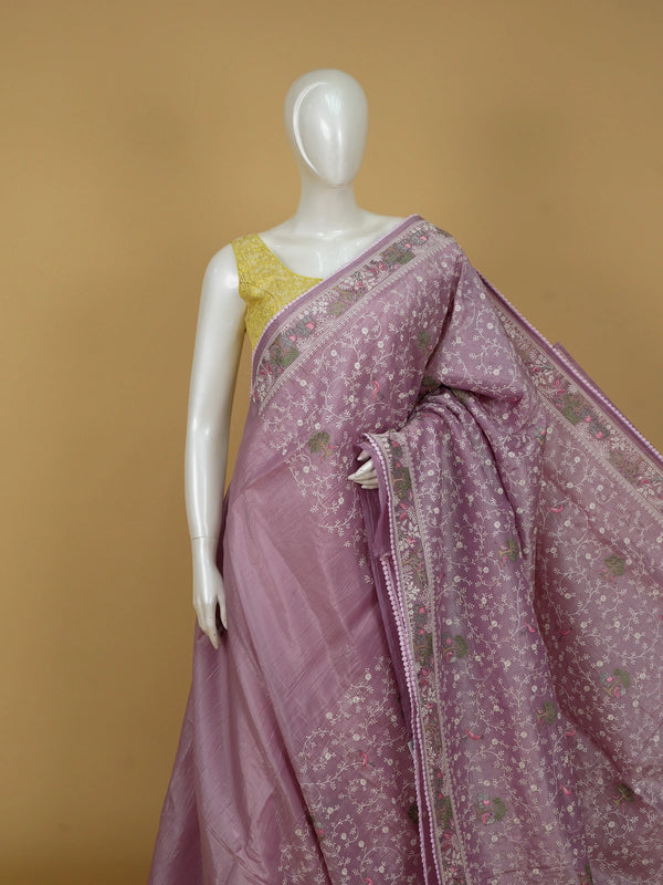 Lavender designer saree with white floral embroidery, bird and elephant motifs and pom-pom lace border