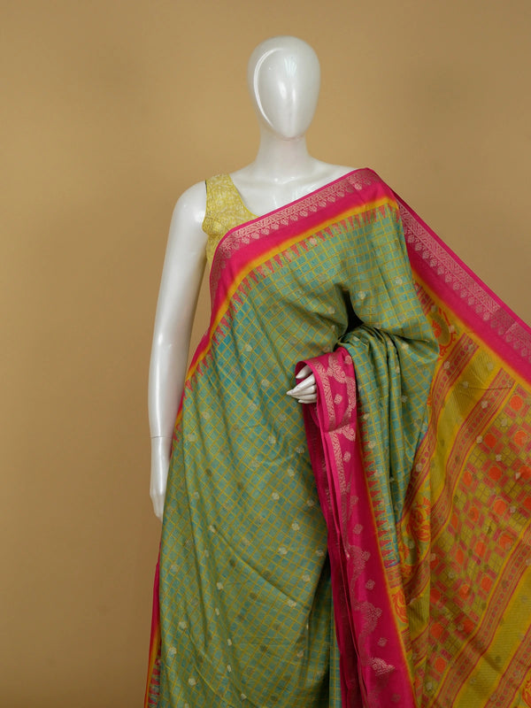 Green Dola silk saree with golden checks, contrast pink zari border and ornate orange-yellow pallu
