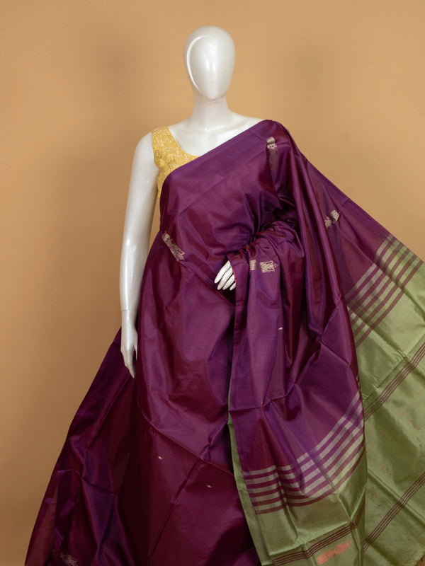 Purple banana silk saree with contrast green zari border and striped pallu