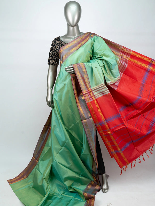 Sea green banana silk saree with contrast red pallu and gold zari border
