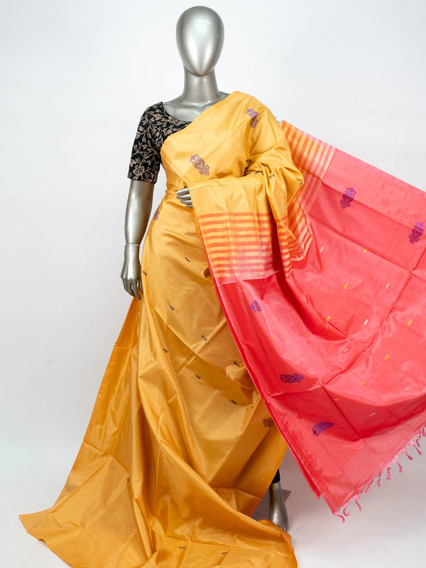 Mustard yellow banana silk saree with contrast pink pallu, purple paisley butis and gold zari work