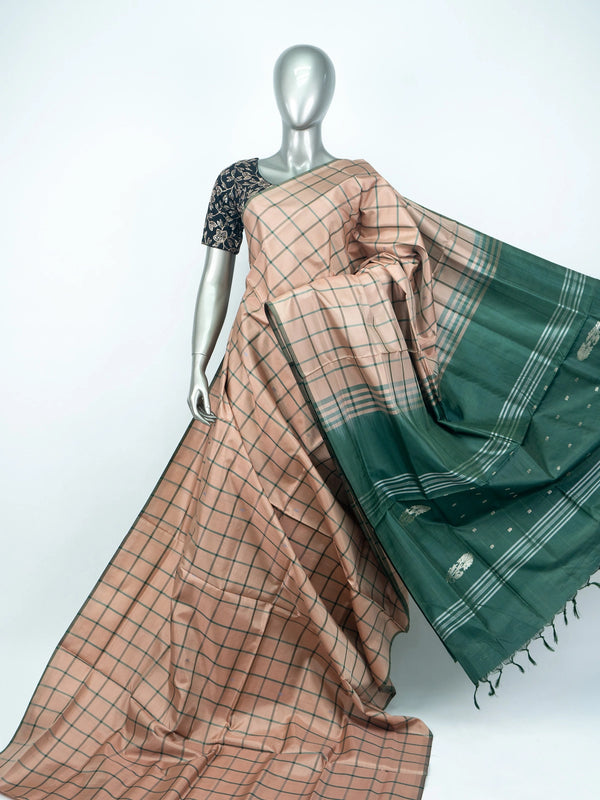 Dusty peach and green checked banana silk saree with green zari pallu and contrast border