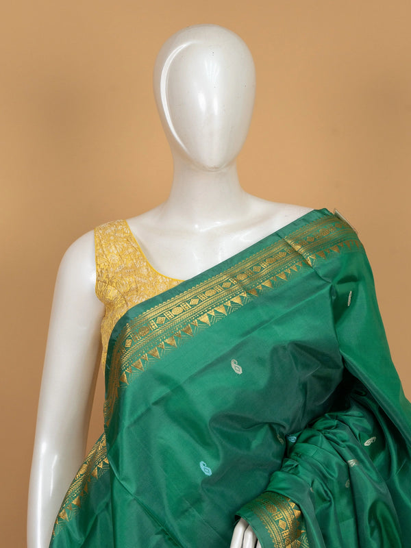 Green Banana Silk saree with gold temple zari border, paisley buttas and contrasting cream pallu