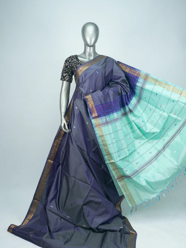 Deep purple Banana Silk saree with contrast turquoise pallu, gold zari border and buti motifs