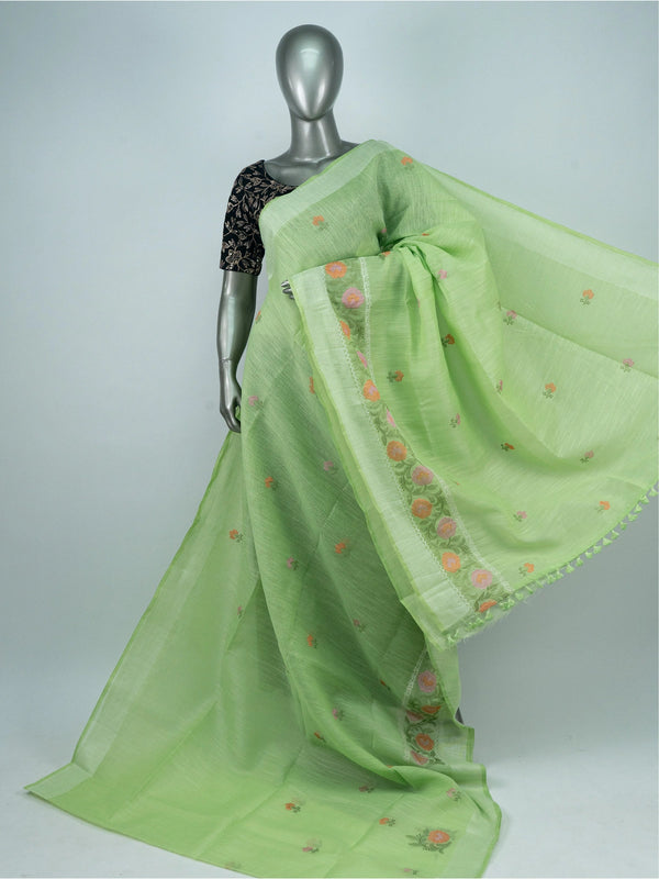 Light green linen cotton saree with silver zari border and multicoloured floral embroidery