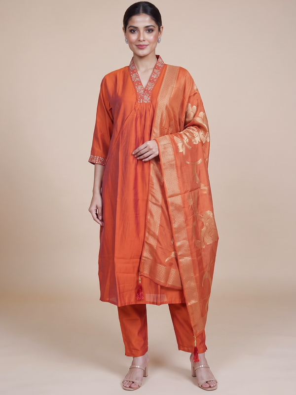 Orange art silk kurti set with embroidered V-neck and gold zari woven dupatta