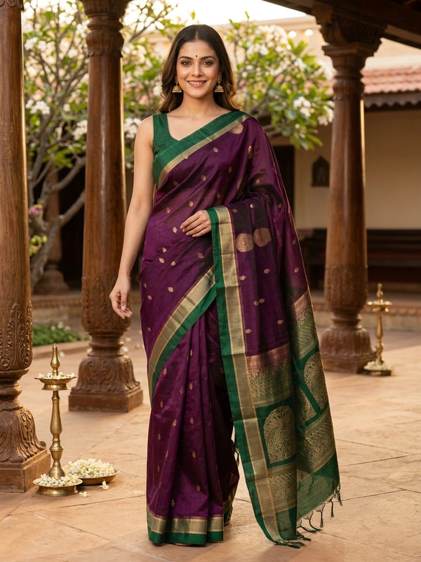 Purple pure silk cotton saree with contrast green zari border and gold peacock motif pallu