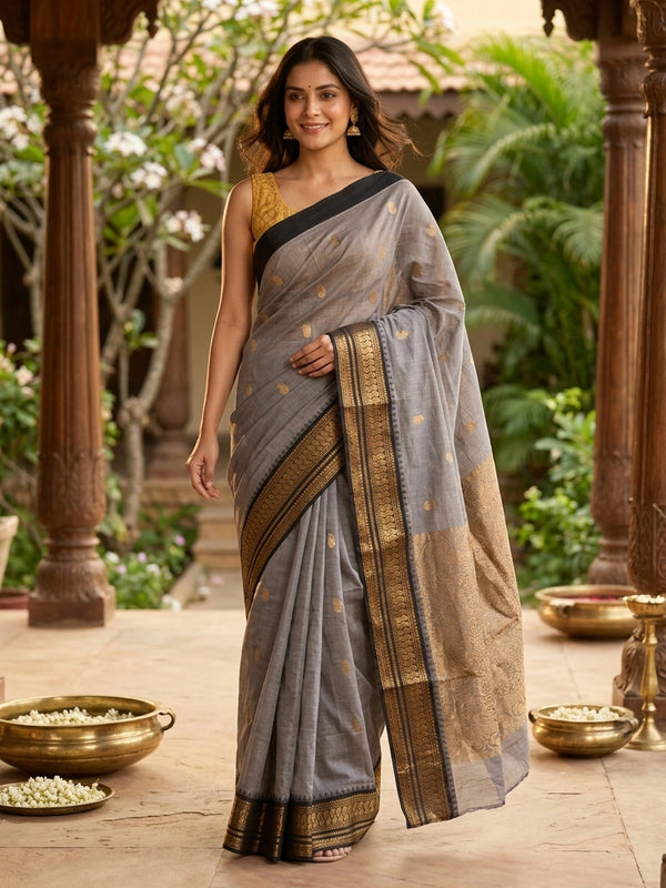 Grey Chettinad cotton saree with black contrast border and gold zari paisley buttas