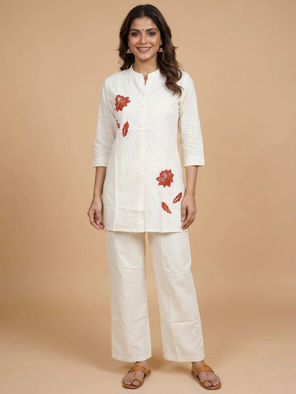 Off-white cotton co-ord set kurti with rust-red floral appliqué and straight pants