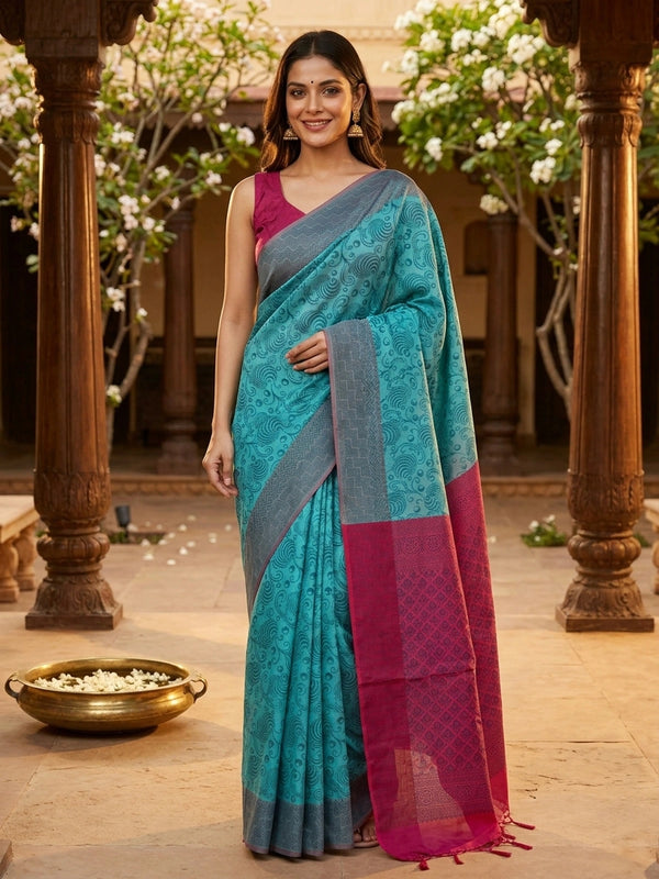 Teal blue silk cotton saree with woven swirl motifs and contrast magenta pink border and pallu