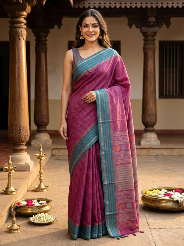 Magenta pink Dola silk saree with teal-blue contrast checked border and floral motif pallu
