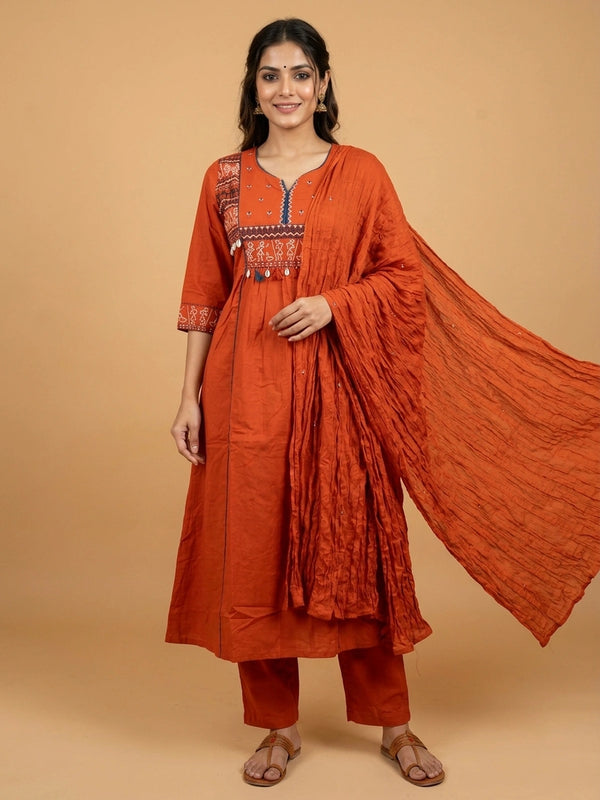 Rust orange cotton Warli embroidered Anarkali kurti set with cowrie shell tassels and matching dupatta