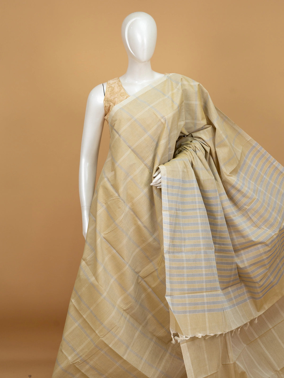 Beige and grey checked silk cotton saree with striped pallu and matching blouse