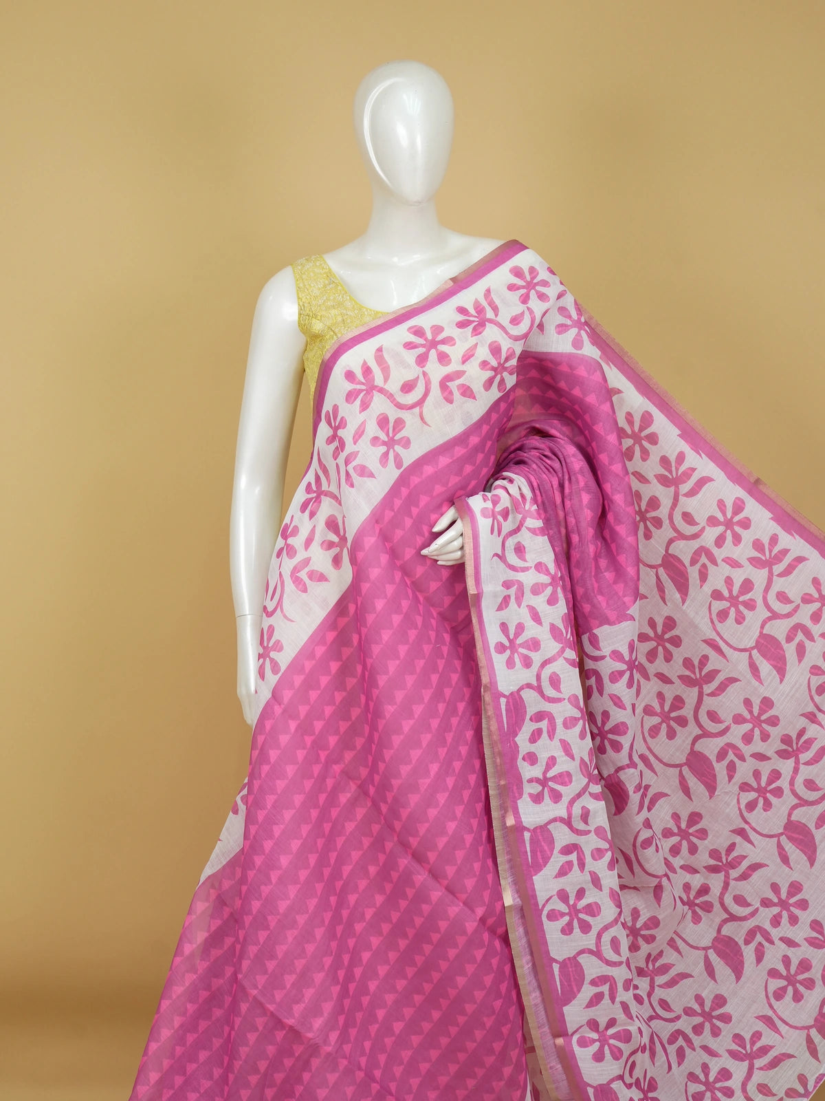 Pink and white linen cotton saree with floral print pallu and gold zari border