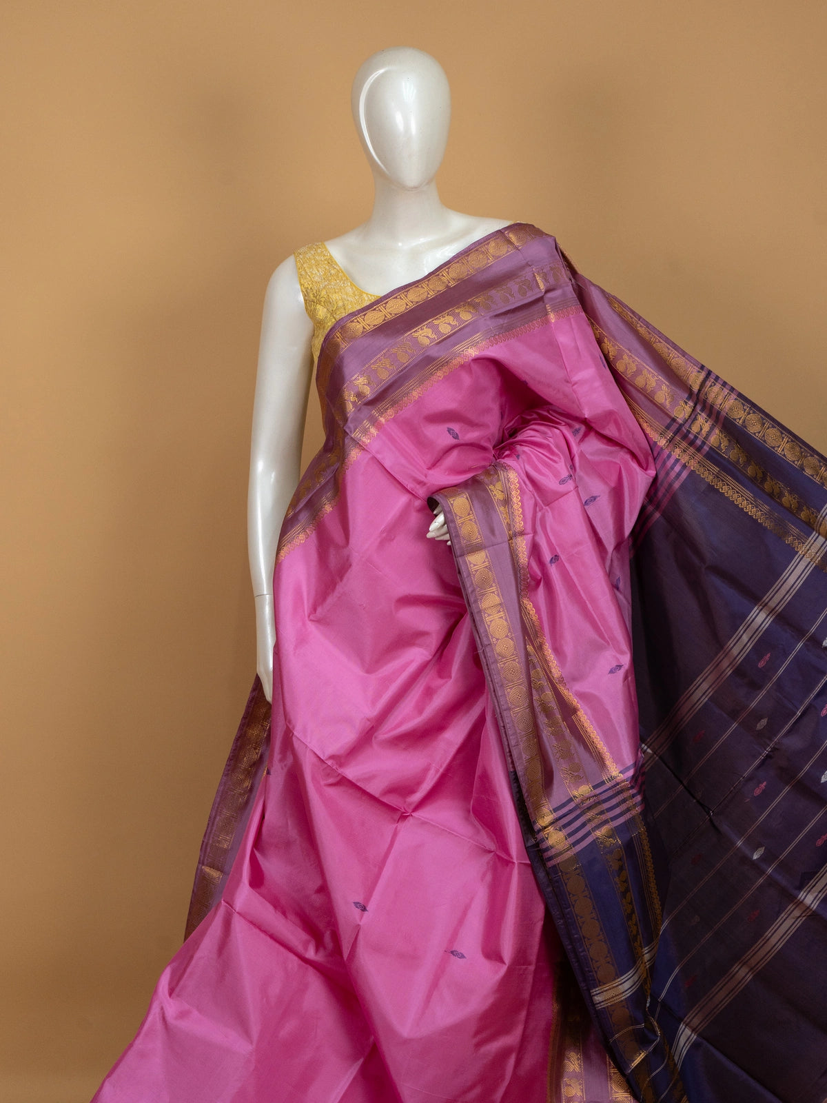 Pink banana silk saree with contrast purple gold zari border and buttis