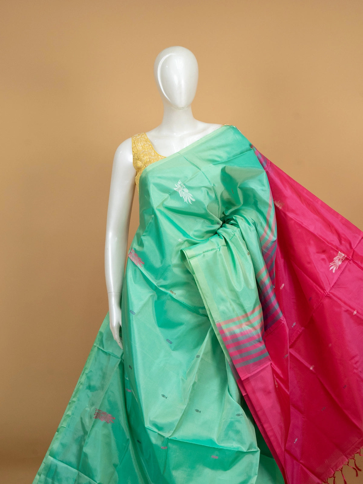 Sea green Banana Silk saree with contrast pink striped pallu and silver zari buttas