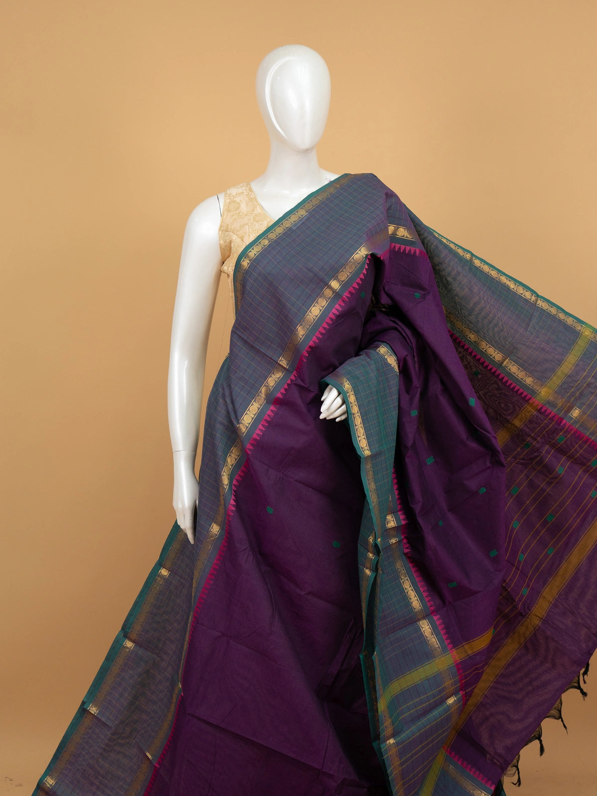 Purple Chettinad cotton saree with teal-green gold zari contrast border, temple motifs and green butta