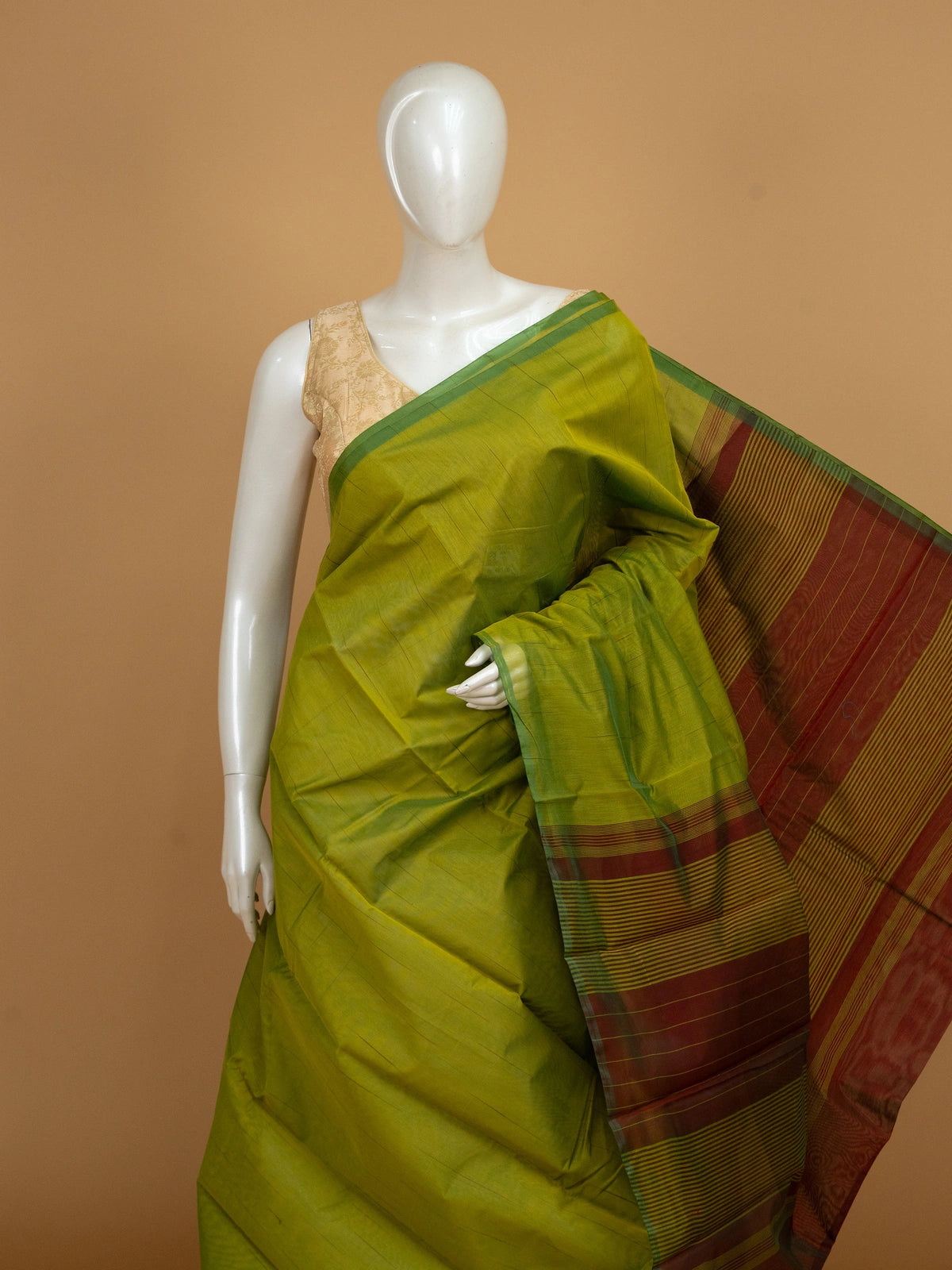 Mehendi green silk cotton saree with contrast green border and maroon gold zari striped pallu
