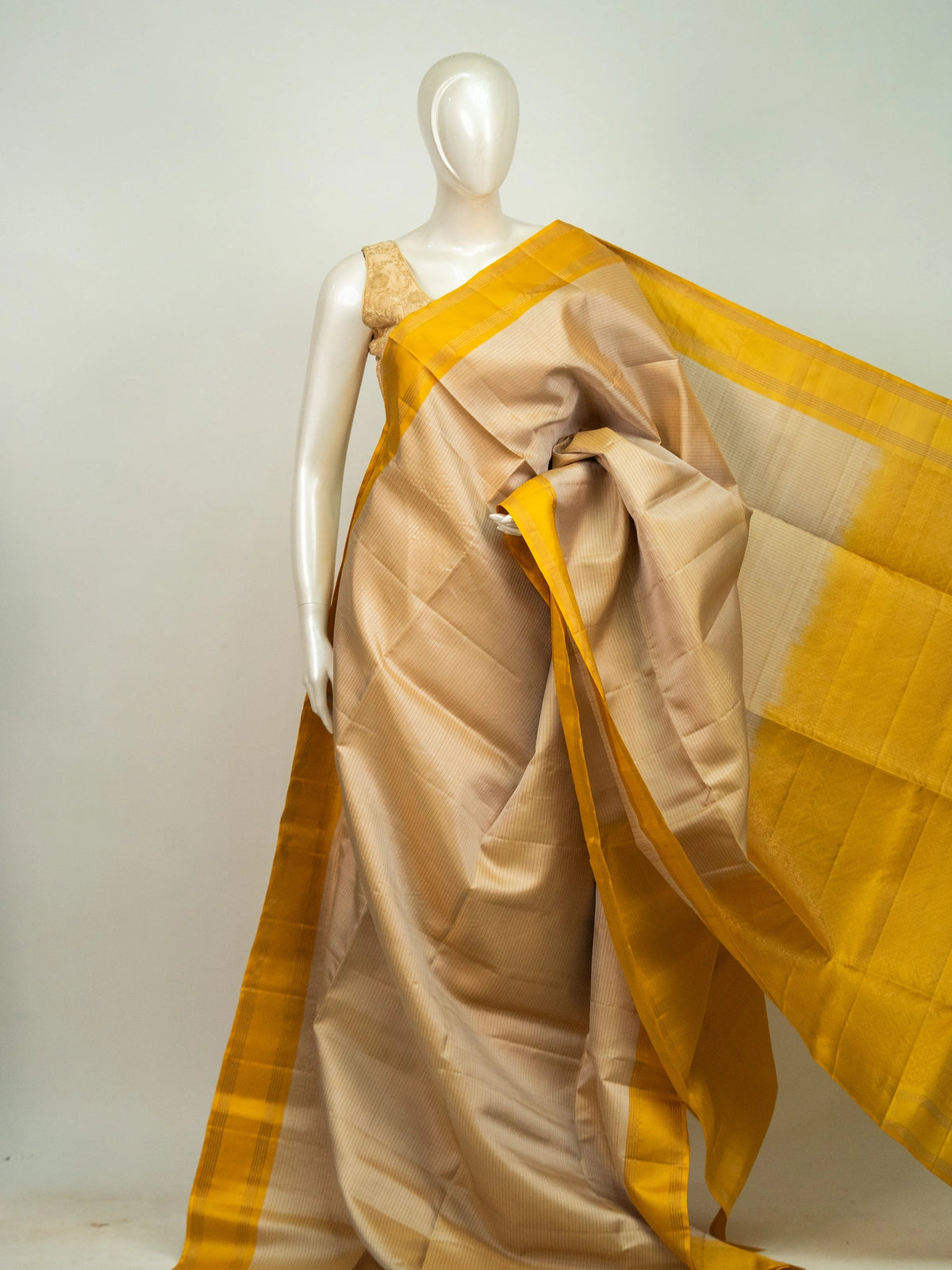 Cream pure soft silk saree with contrast mustard-yellow gold zari border and tasselled pallu